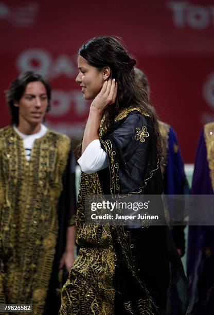 Ana Ivanoic of Serbia enters the centre court wearing a Jalabya during the opening ceremony of the WTA Qatar Total Open at the Khalifa International...