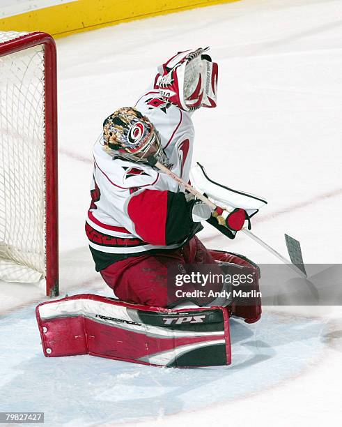 John Grahame of the Carolina Hurricanes defends his goal on a shot by the New Jersey Devils during their game at the Prudential Center on February...