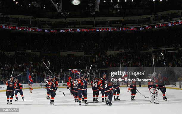 The New York Islanders salute the crowd after a come behind victory against the San Jose Sharks at the Nassau Coliseum February 18, 2008 in...