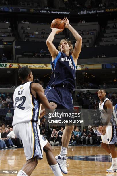 Dirk Nowitzki of the Dallas Mavericks goes up for the shot during the NBA game against the Memphis Grizzlies at the FedExForum on January 28, 2008 in...