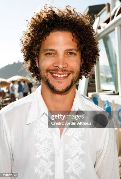 Singer Justin Guarini attends Los Angeles Confidential Magazine and French Connection's summer beach party and clambake to benefit the Art of Elysium...