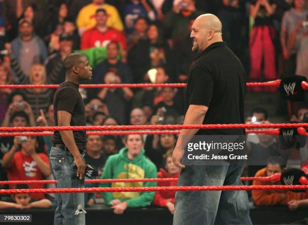 Welterweight Champion Floyd Mayweather Jr. And WWE Superstar Big Show confront one another at WWE Monday Night Raw at The Honda Center on February...