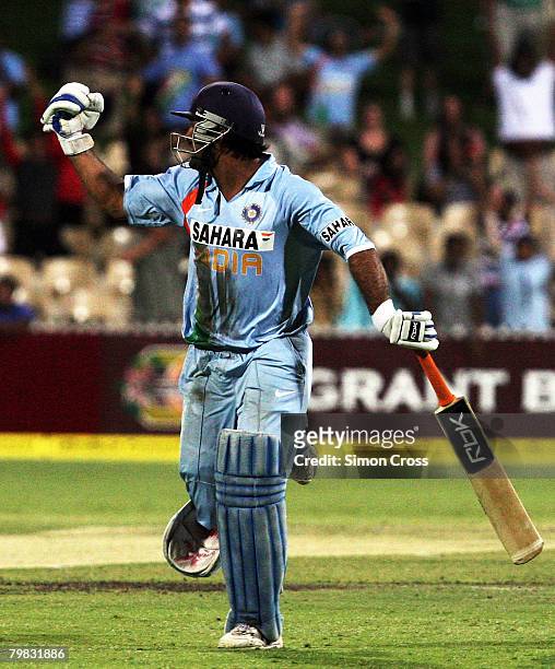 Dhoni of India celebrates after hitting the winning runs and bringing up his 50 during the Commonwealth Bank Series One Day International match...