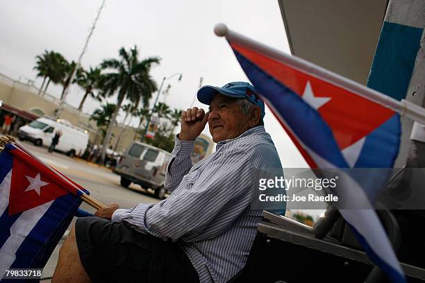 Orlando Gonzalez holds Cuban flags across the street from the Versailles restaurant in the Little Havana neighborhood February 19, 2007 in Miami,...