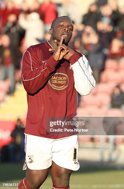 Adebayo Akinfenwa of Northampton Town celebrates after scoring his second and his sides third goal during the Coca Cola League One Match between...