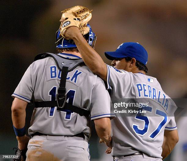 Kansas City Royals reliever Joel Peralta and catcher John Buck celebrate after the final out of 12-4 victory over the Los Angeles Angels of Anaheim...