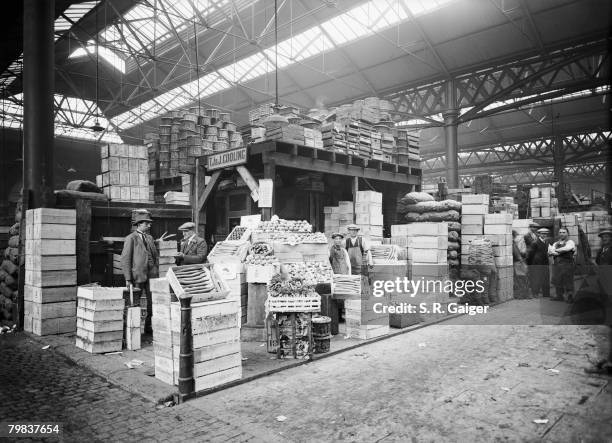 T. J. & J. Cooling's fruit and vegetable stand in Old Spitalfields Market, May 1928.
