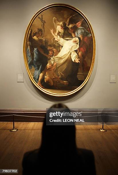 Painting entitled "The Ecstasy of Saint Catherine of Siena" by Italian artist Pompeo Batoni, is pictured at the National Gallery in London, on...