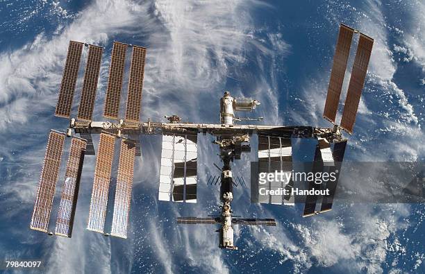 In this photo provided by the European Space Agency and NASA, the International Space Station is seen from Atlantis as the orbiter undocks February...