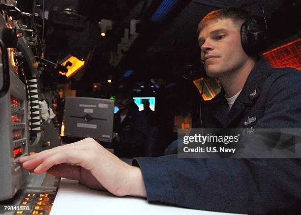 In this photo provided by the U.S. Navy, Fire Controlman 2nd Class John Whitby, from San Leandro, CA, operates the radar system control in the combat...