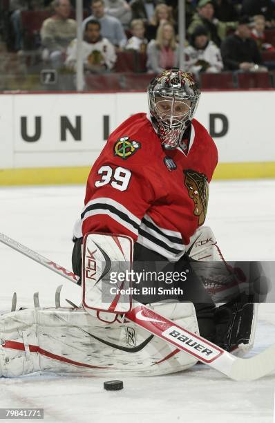 Nikolai Khabibulin of the Chicago Blackhawks stops the puck against the Columbus Blue Jackets on January 24, 2008 at the United Center in Chicago,...