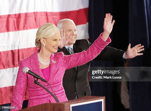 Republican presidential hopeful Sen. John McCain and wife Cindy greet supporters during a campaign rally at the Hayes Grand Ballroom February 19,...