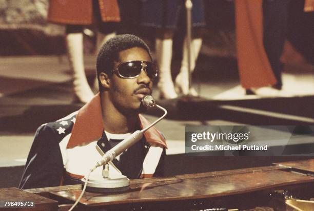 American singer-songwriter and keyboard player Stevie Wonder performs on a television show in London, circa 1974.