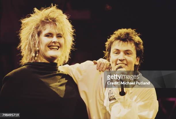 English singer Paul Young performs live on stage with guest vocalist Alison Moyet on one of two nights at Wembley Arena, London, 5th-6th December...