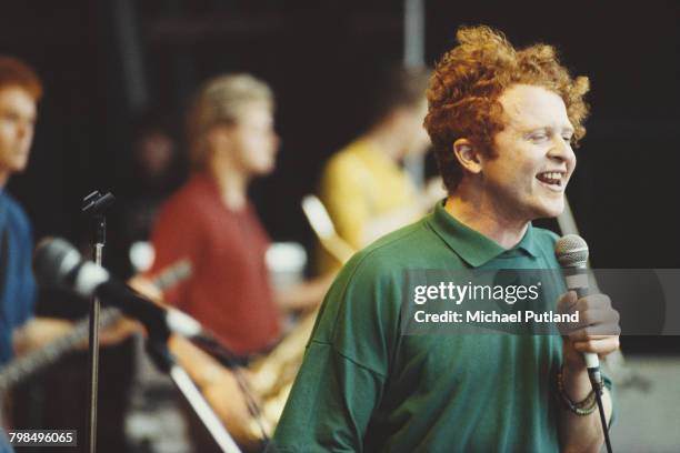 Singer Mick Hucknall performs live with Simply Red on the Pyramid Stage at the Glastonbury Festival near Pilton, Somerset, 22nd June 1986.