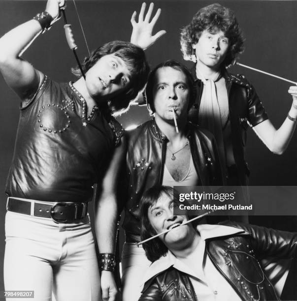 English pop and glam rock group Mud posed together on 19th September 1975. Left to right: bassist Ray Stiles, drummer Dave Mount , singer Les Gray...