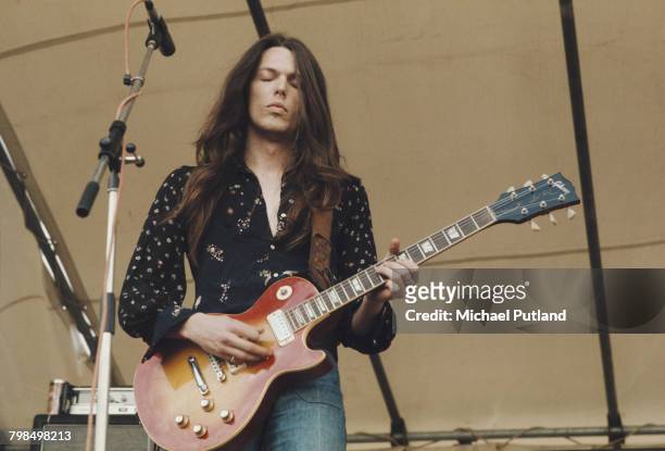 American guitarist Scott Gorham performs playing a Gibson Les Paul guitar on stage with Irish rock group Thin Lizzy at the Reading Festival, 24th...