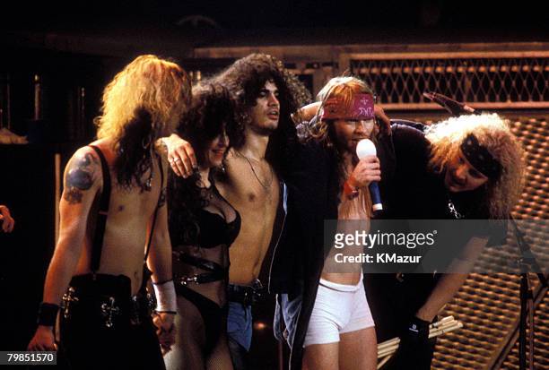 Duff McKagan, backup singer, Slash, Axl Rose and Matt Sorum of Guns N' Roses in 1993