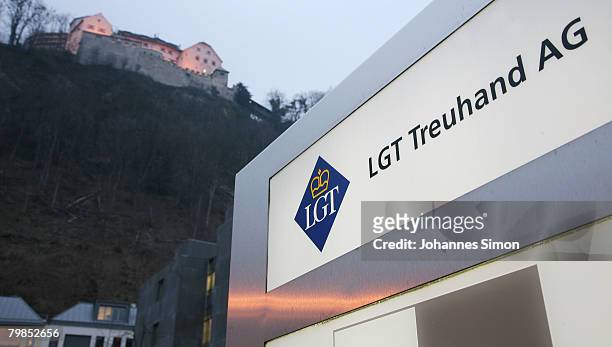 The company nameplate of the LGT Treuhand AG is seen beneath the Liechtenstein castle on February 15, 2008 in Vaduz, Liechtenstein. Suspected tax...
