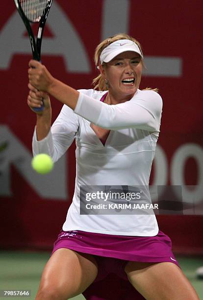 Maria Sharapova of Russia returns the ball to her compatriot Gallina Voskoboeva during their tennis match on the third day of the 2.5 million dollar...