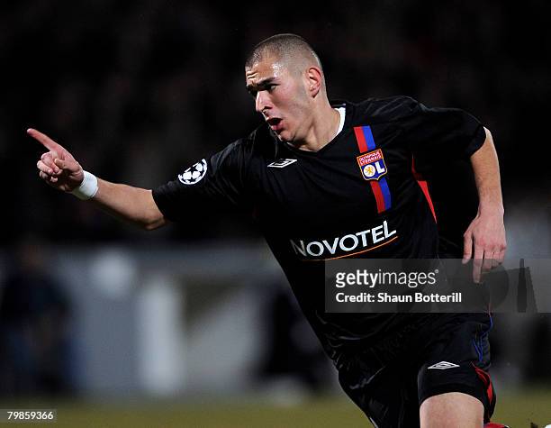 Karim Benzema of Lyon celebrates after scoring during the UEFA Champions League first knockout round, first leg match between Lyon and Manchester...