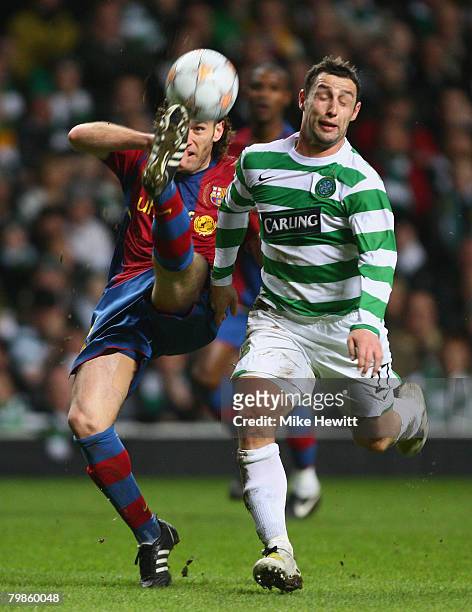 Gabriel Milito of Barcelona beats Scott McDonald of Celtic to the ball during the UEFA Champions League First Knockout Round First Leg match between...