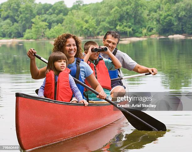 hispanic family canoeing - andare in canoa foto e immagini stock