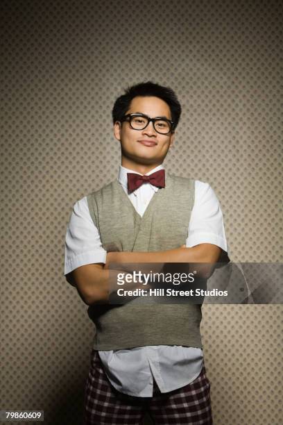 nerdy asian man with arms crossed - オタク ストックフォトと画像