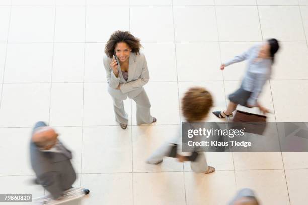 african businesswoman talking on cell phone - stay indoors stock pictures, royalty-free photos & images