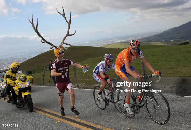 Robert Gesink of the Netherlands, riding for Rabobank, and Levi Leipheimer of the United States, riding for Astana, climb Sierra Road as a race fan,...