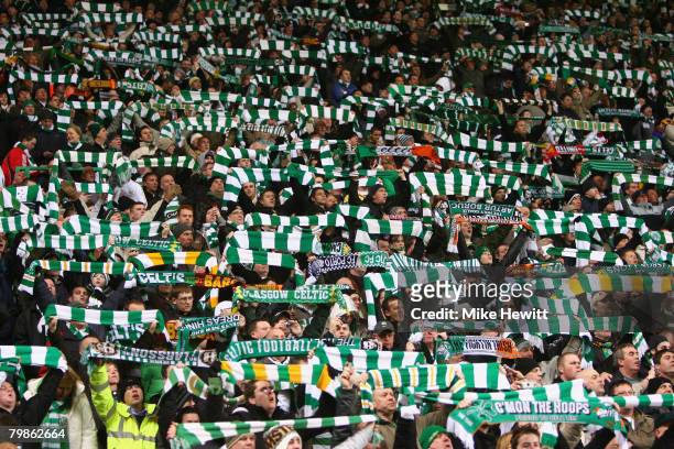 Celtic fans show their support during the UEFA Champions League First Knockout Round First Leg match between Celtic and Barcelona at Celtic Park on...