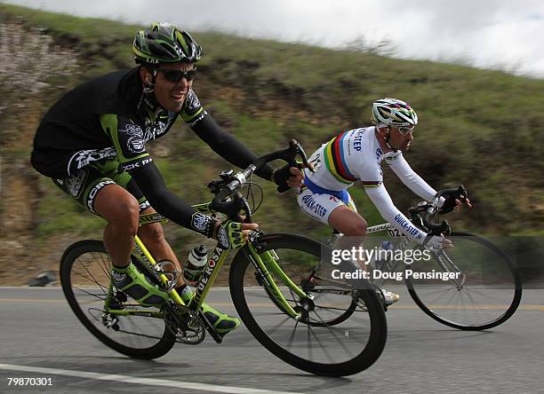 Victor Hugo Pena of the Columbia, riding for Rock Racing, and Paolo Bettini of Italy, riding for Quick Step, ride down Mount Hamilton in Stage 3 of...