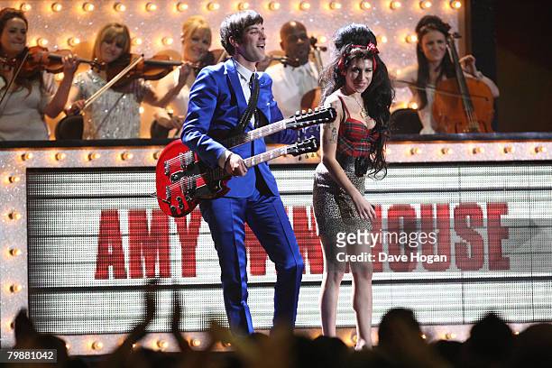 Mark Ronson and Amy Winehouse perform on stage at the BRIT Awards 2008 at Earls Court 1 on February 20, 2008 in London, England.
