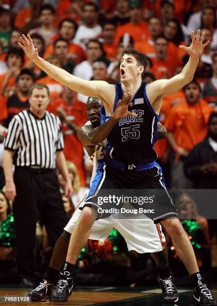 Brian Zoubek of the Duke Blue Devils calls for the ball while being closely guarded by Dwayne Collins of the Miami Hurricanes at BankUnited Center on...