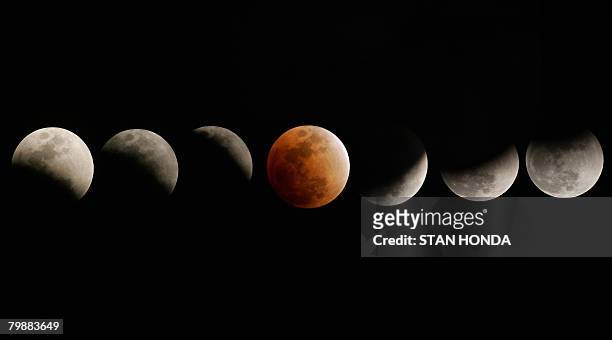The moon enters and emerges from the earth's shadow during a total eclipse of the moon on February 20, 2008 over in Titusville, Florida in this...