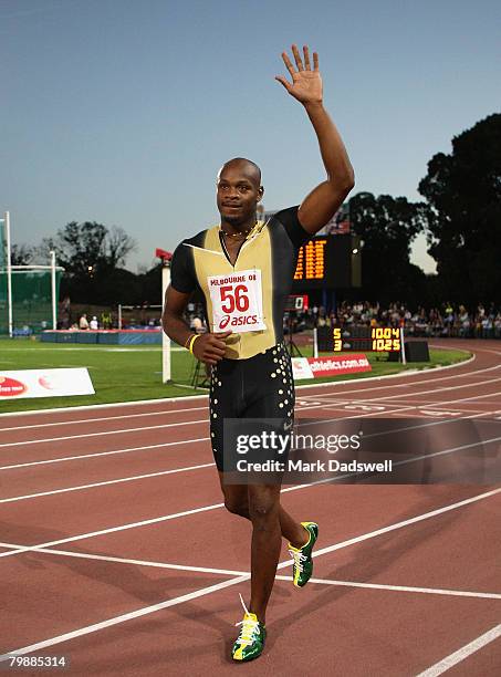 Asafa Powell of Jamaica salutes the crowd after winning the Mens 100 Metres A race during the Melbourne Athletics Grand Prix IAAF World Athletics...