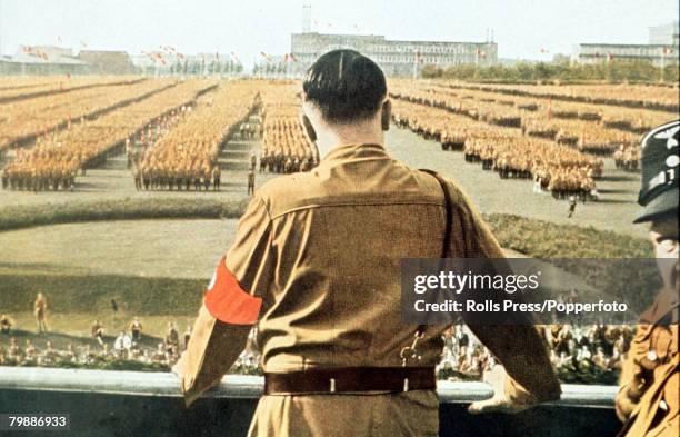 German Fuhrer and Nazi leader Adolf Hitler addresses soldiers with his back facing the camera at a Nazi rally in Dortmund, Germany, circa 1933.