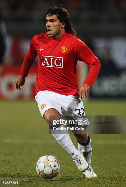 Carlos Tevez of Manchester United in action during the UEFA Champions League first knockout round, first leg match between Lyon and Manchester United...