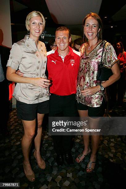 Australian netball player Catherine Cox, Jared Crouch of the Swans and Australian netball captain Liz Ellis during the Sydney Swans official launch...