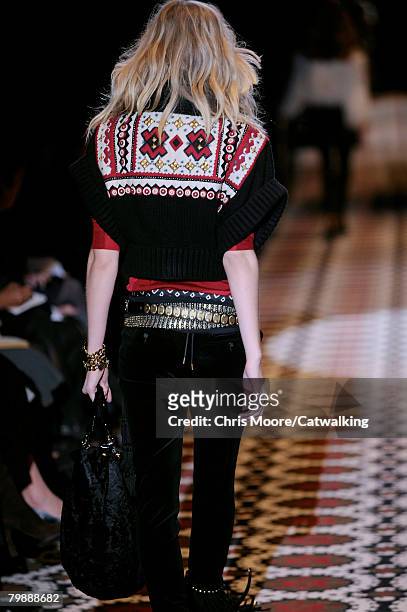 Model walks the runway wearing the Gucci Fall/Winter 2008/2009 collection during Milan Fashion Week on the 20th of February 2008 in Milan, Italy.