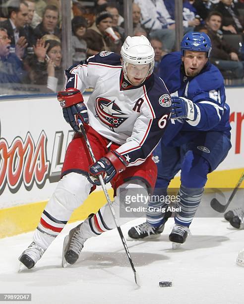 Bryan McCabe of the Toronto Maple Leafs skates after Rick Nash of the Columbus Blue Jackets February 19, 2008 at the Air Canada Centre in Toronto,...