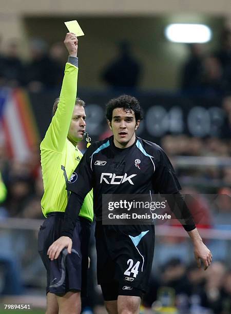 John O'Brien of Bolton Wanderers gets the yellow card from referee Jacek Granat during the UEFA Cup Round of 32, Second Leg match between Atletico...