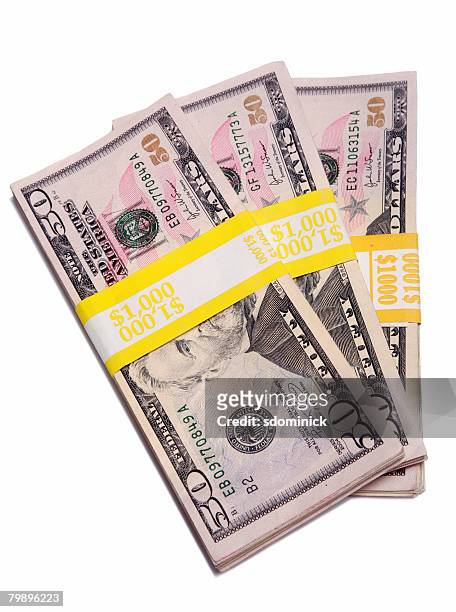 an isolated stack of money totalling $3000 usd. - 50 dollar bill stock-fotos und bilder