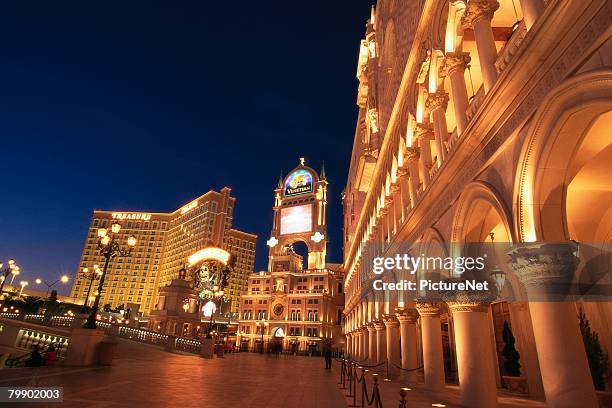 venetian and treasure island - venetian hotel las vegas stock pictures, royalty-free photos & images