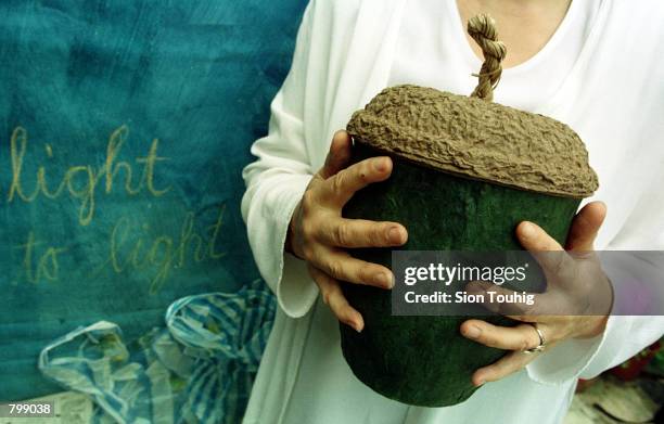 Designer Hazel Selina displays her eco-friendly ''Acorn'', a container for cremated ashes April 8, 2001 at the ''Day for the Dead'' event at The...