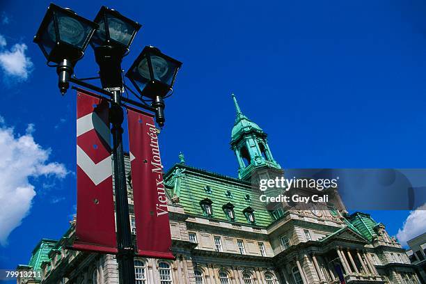 lamppost by hotel de ville - hotel de ville montreal stock pictures, royalty-free photos & images