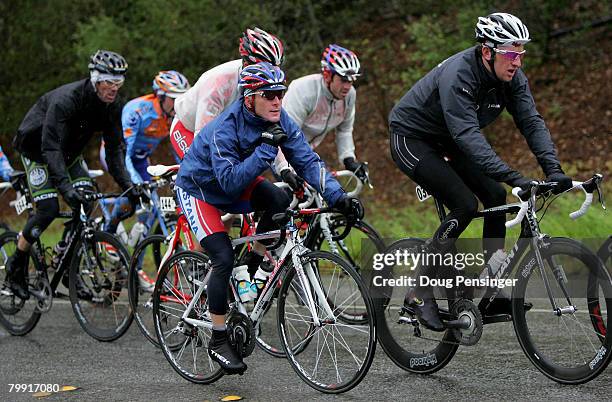 Overall race leader Levi Leipheimer of the USA and riding for Astana zips up his rain jacket as he rides in the peloton during Stage 4 of the Amgen...