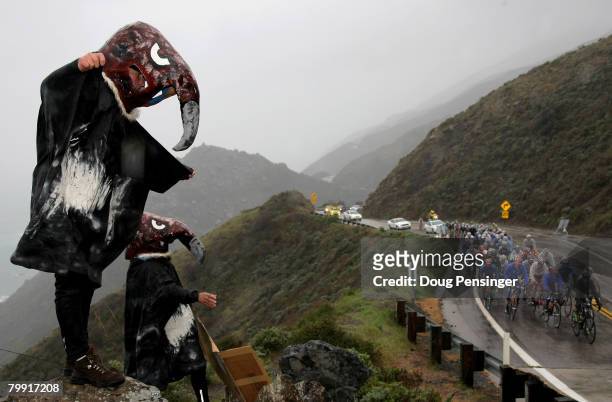 Two fans dressed as California Condors cheer on the peloton as they head down The Pacific Coast Highway on a rain soaked Stage 4 of the Amgen Tour of...