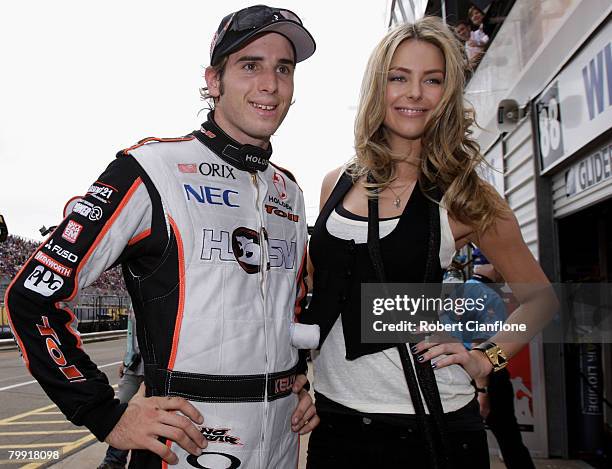 Australian Model and TV presenter Jennifer Hawkins stands in the pitlane with V8 Supercar driver Rick Kelly at the Clipsal 500 which is round one of...
