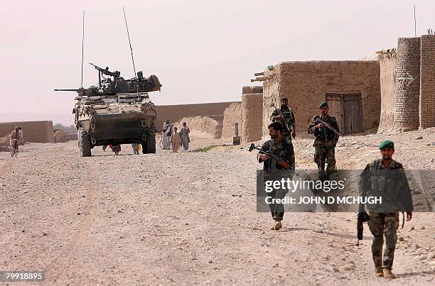 File picture taken on November 08 in a volatile area in Panjwayi district, Kandahar province, shows Canadian soldiers from the Royal 22nd Regiment,...